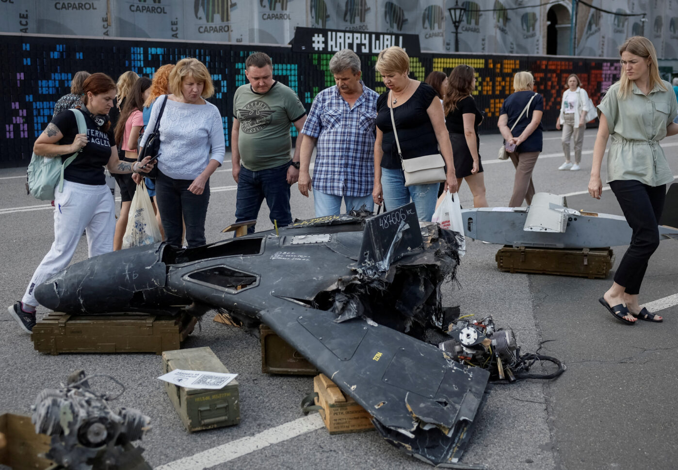 People look at a destroyed Russian combat drone during a visit to an exhibition in central Kiev dedicated to the defense of Chasovoy Yar, Ukraine